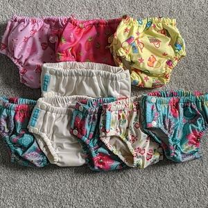 Lot of 9 reusable swim diapers medium and large